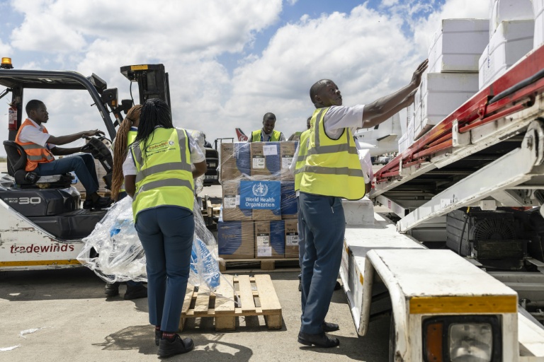 Ground crew load medical supplies onto a UN-operated charter plane bound for Bunia in eastern Democratic Republic of Congo as part of the World Health Organization (WHO) response to the latest deadly Ebola outbreak