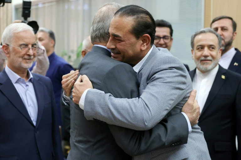 Iranian President Masoud Pezeshkian embraces Pakistan’s army chief Syed Asim Munir, a key mediator in Tehran’s conflict with Washington. (Photo: AFP)