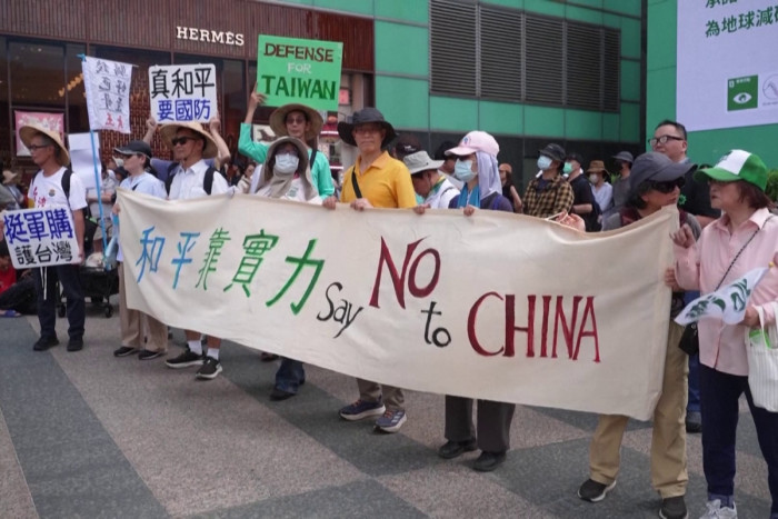 Protests in Taipei after parliament limits defense spending