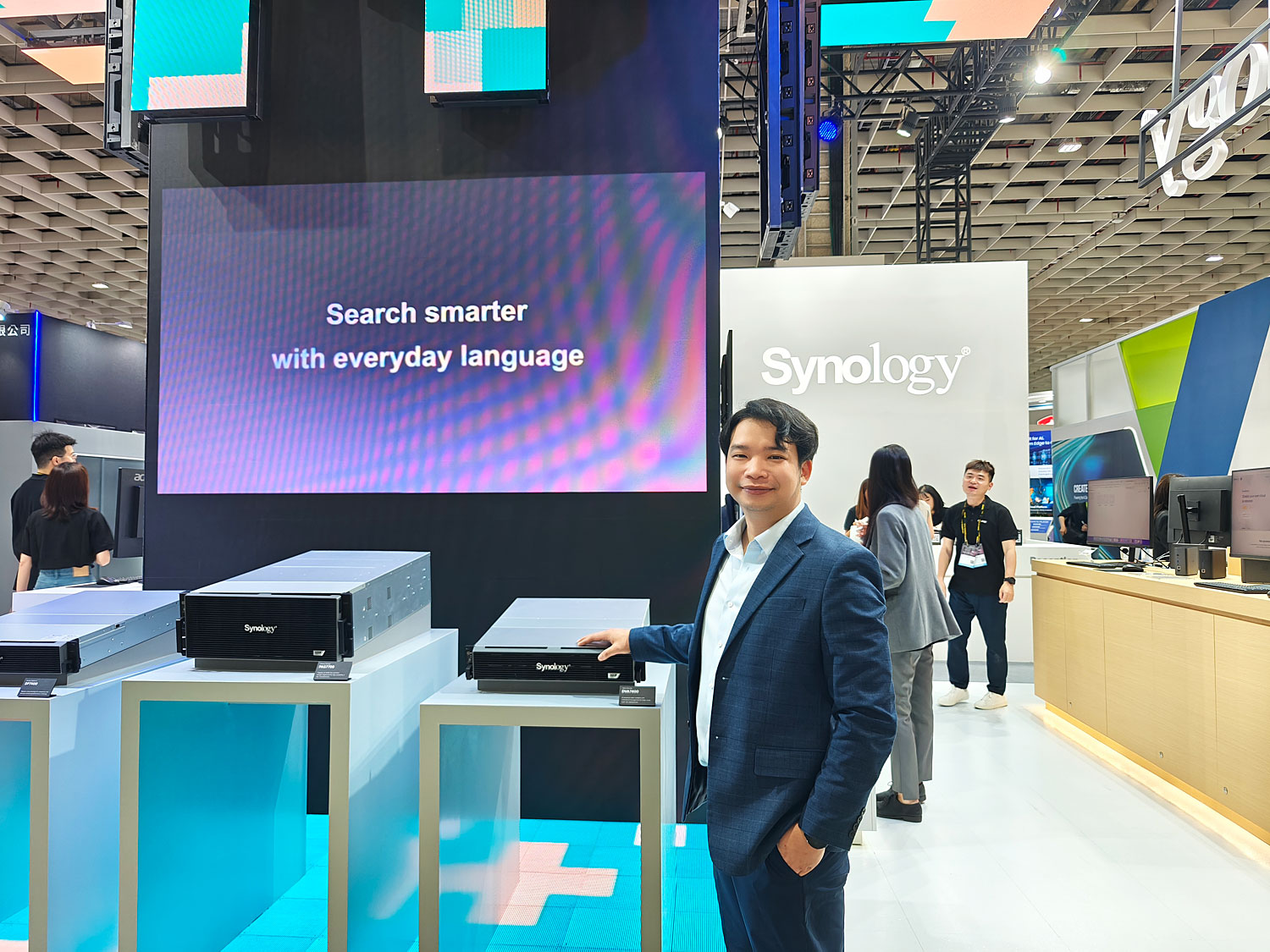 Rahat Boontanjin, Synology Country Manager of Thailand showing the media around Synology booth.