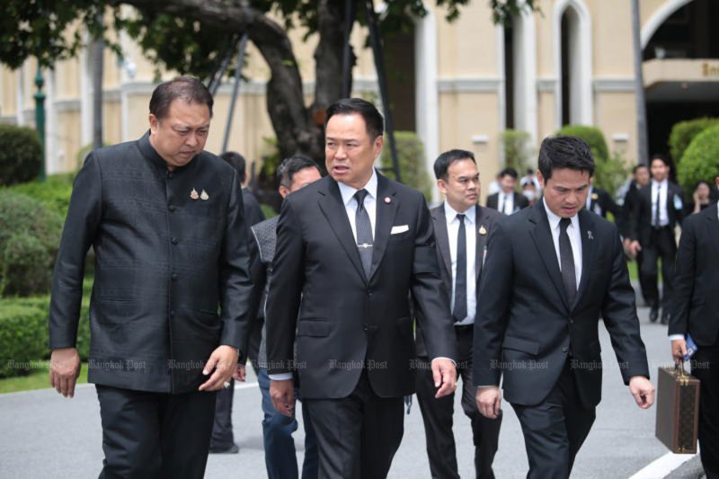 Prime Minister Anutin Charnvirakul, centre, walks alongside Natural Resources and Environment Minister Suchart Chomklin, left, and Deputy Prime Minister's Office Minister Paradorn Prissananantakul, right, as they arrive at Government House on Friday. (Photo: Chanat Katanyu)