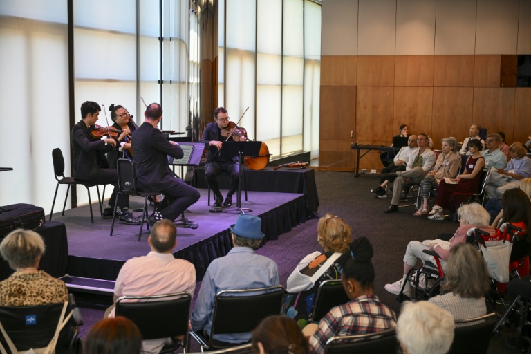Attendees participate in New York's 'Lincoln Center Moments,' a performance-based program created for people living with dementia and their caregivers. (Photo: AFP)