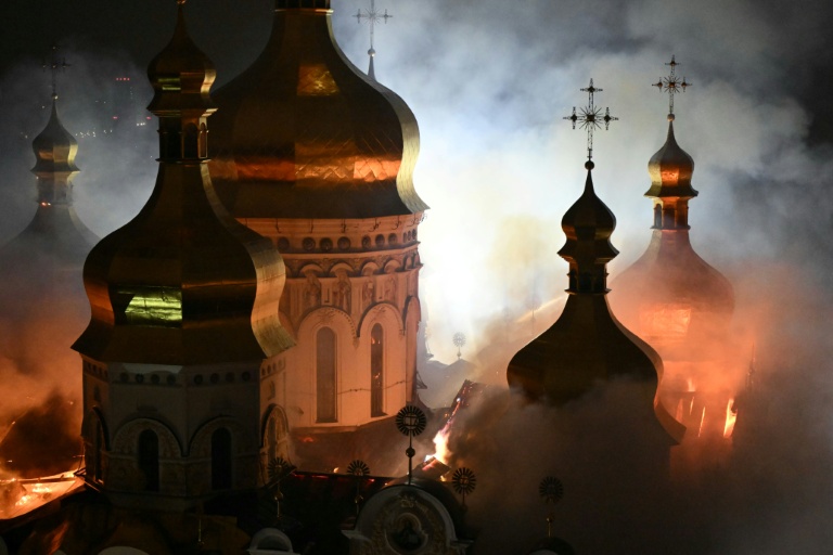 Smoke and fire rises from the Dormition Cathedral in the Orthodox in Kyiv