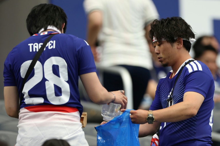 Japan fans tidied up after themselves after their team's opening World Cup game against the Netherlands in Texas on Sunday. (Photo: AFP)