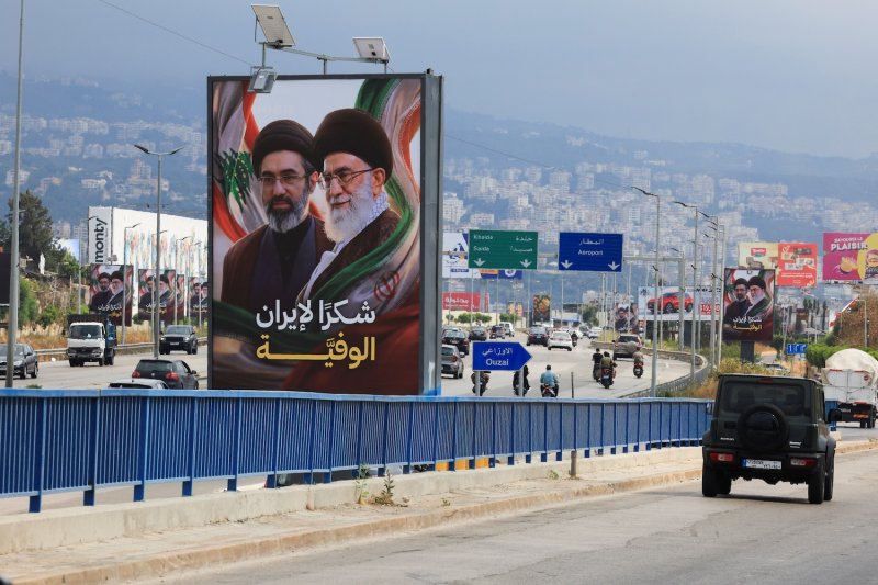 Cars and motorbikes drive past billboards showing Iran’s new Supreme Leader Ayatollah Mojtaba Khamenei and his late father Ali Khamenei, with the slogan “Thank you to loyal Iran” erected along the highway leading to Rafic Hariri International Airport in Beirut, Lebanon. (Photo: Reuters)