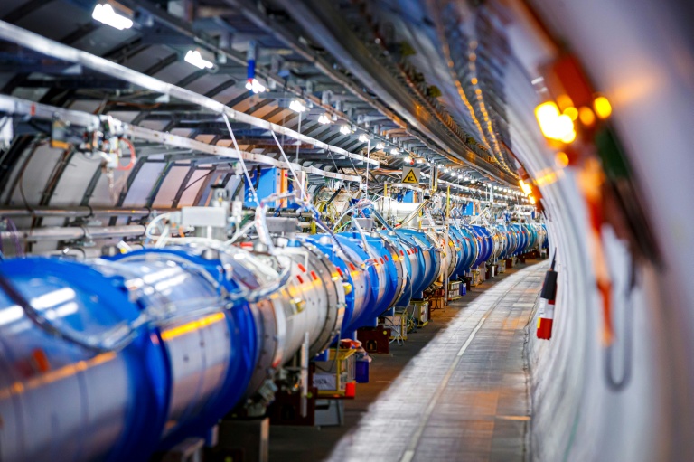 Some of the 1232 dipole magnets that bend the path of accelerated protons are pictured in the Large Hadron Collider (LHC), which will be shut down for four years of renovations