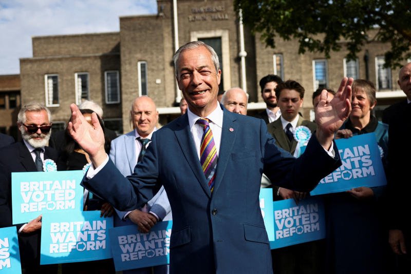 Britain's Reform UK leader Nigel Farage reacts next to newly elected councillors at the Havering Town Hall, following the results of the local elections, in the London Borough of Havering, Britain, on May 8, 2026. (Photo: Reuters)