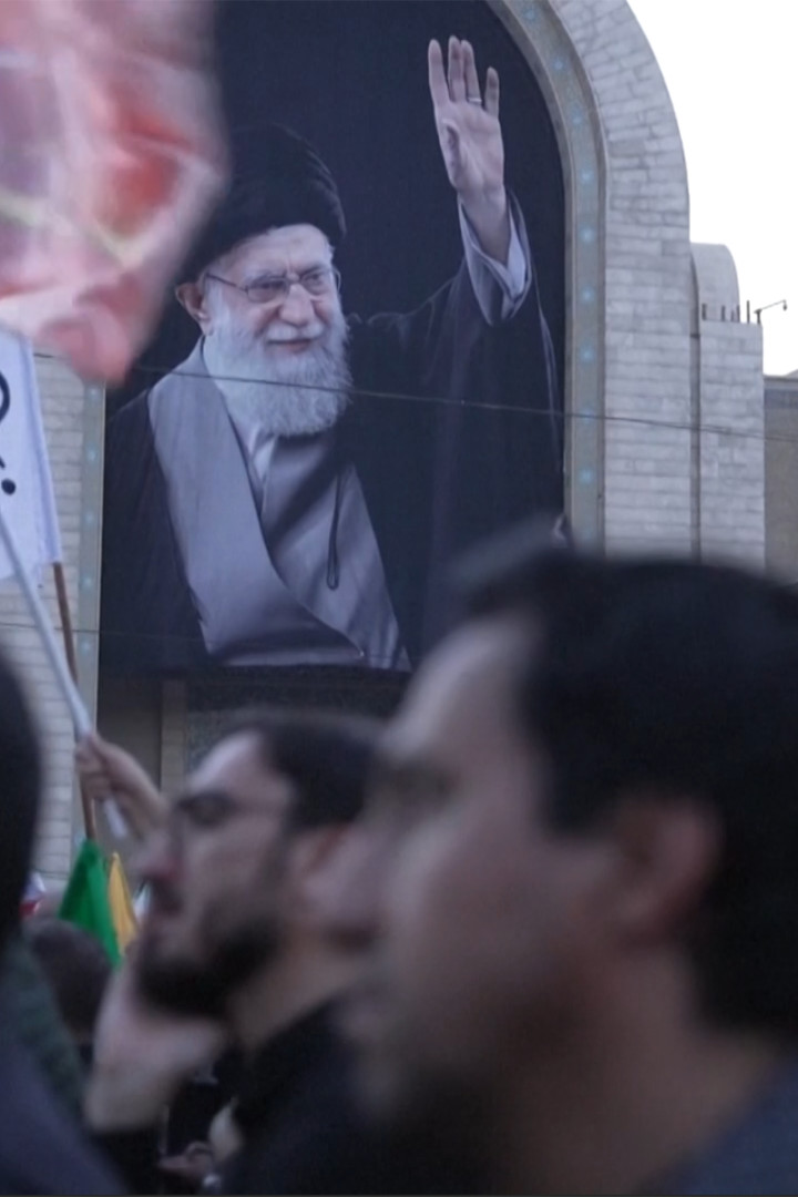 Mourners sign messages on walls of Grand Mosalla during Khamenei funeral