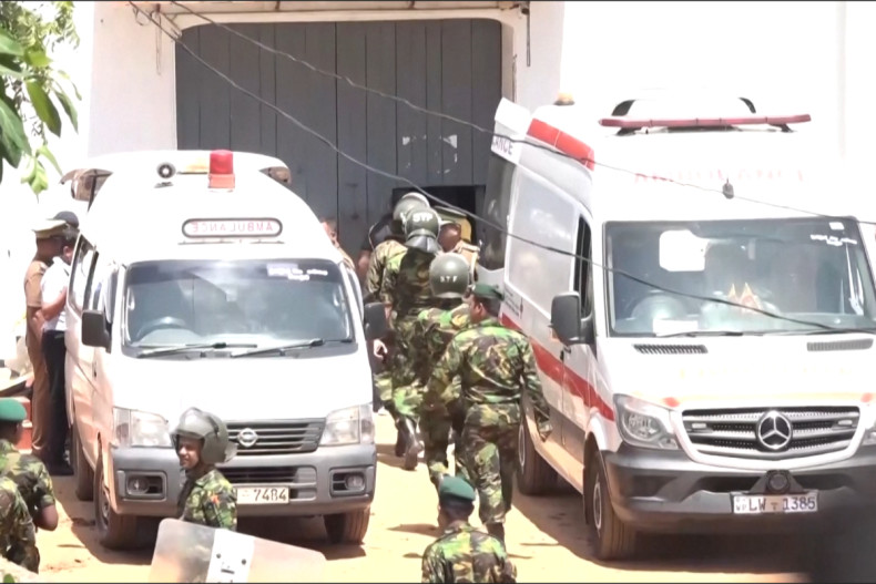 Body bags and injured taken from Sri Lanka prison after deadly clashes