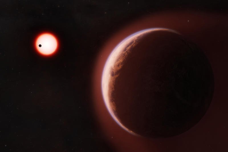 In an undated image provided by Melissa Weiss/CFA, an artist’s concept of the exoplanet LHS 1140b, surrounded by a helium-rich atmosphere, with another rocky planet orbiting the same cool red dwarf star in the distance. (Photo via New York Times)