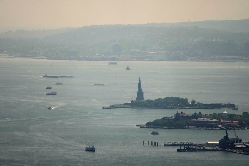 The Statue of Liberty is seen through a cover of wildfire smoke in New York City on July 17, 2026. (Photo: Reuters)