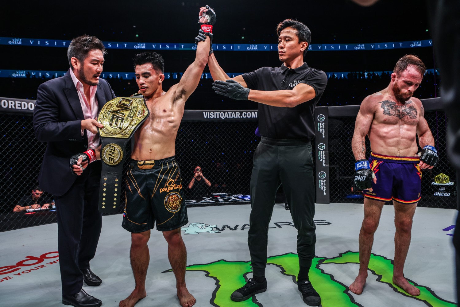 Joshua Pacio celebrates after regaining the undisputed ONE Championship strawweight MMA title from Jarred Brooks at ONE 171