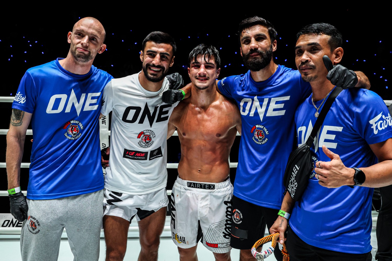 Ramadan Ondash celebrates with elder brother Abdallah and his team after improving to 2-0 at flyweight