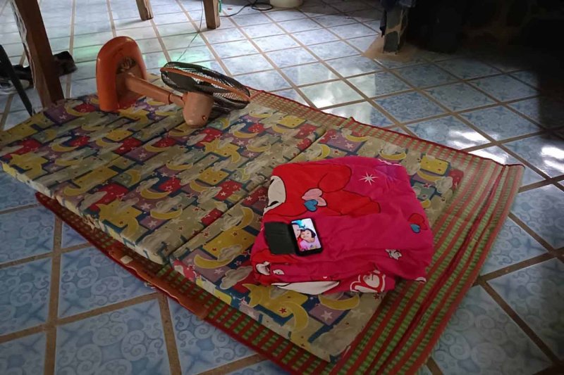 A mat, a mobile phone and a fallen electric fan were discovered at the living quarters of the park ranger on Wednesday morning. Photos: Department of National Parks, Wildlife and Plant Conservation