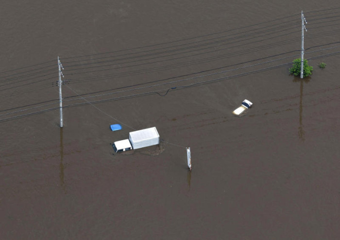 Thousands stranded at Japan's Narita airport after record rain kills four