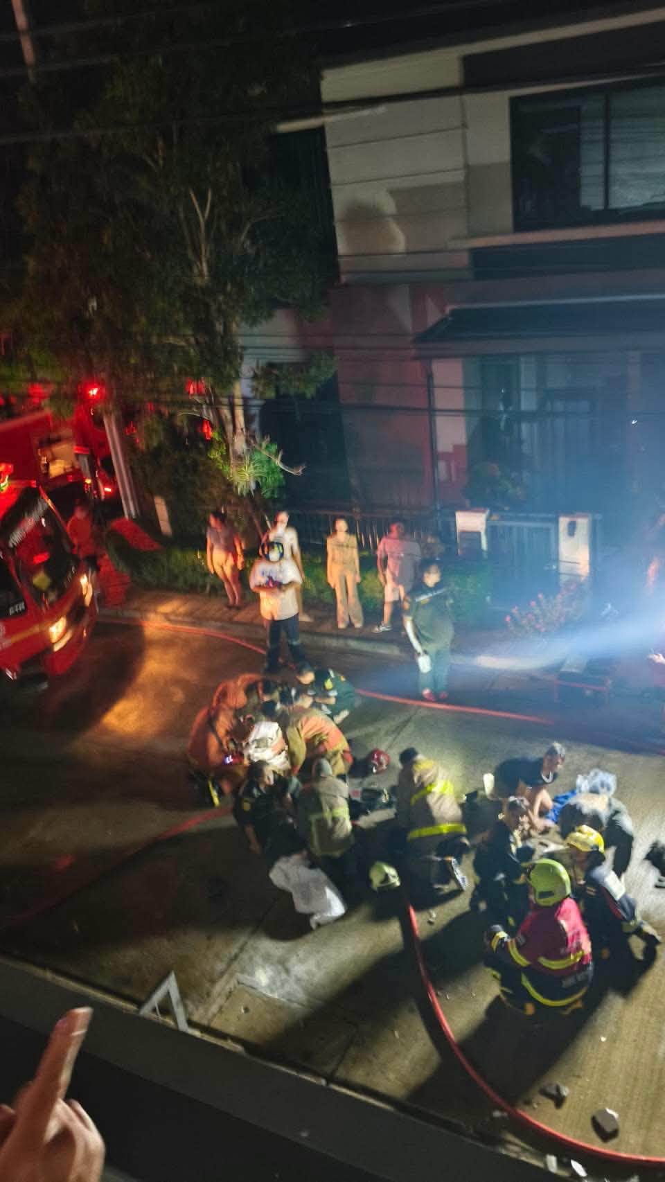 Rescue workers perform cardiopulmonary resuscitation to many cats that had been brought out from the burning house. (Photo: Fire & Rescue Thailand)
