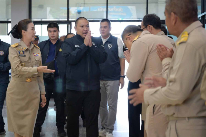 A group of people in uniform gathered indoors.