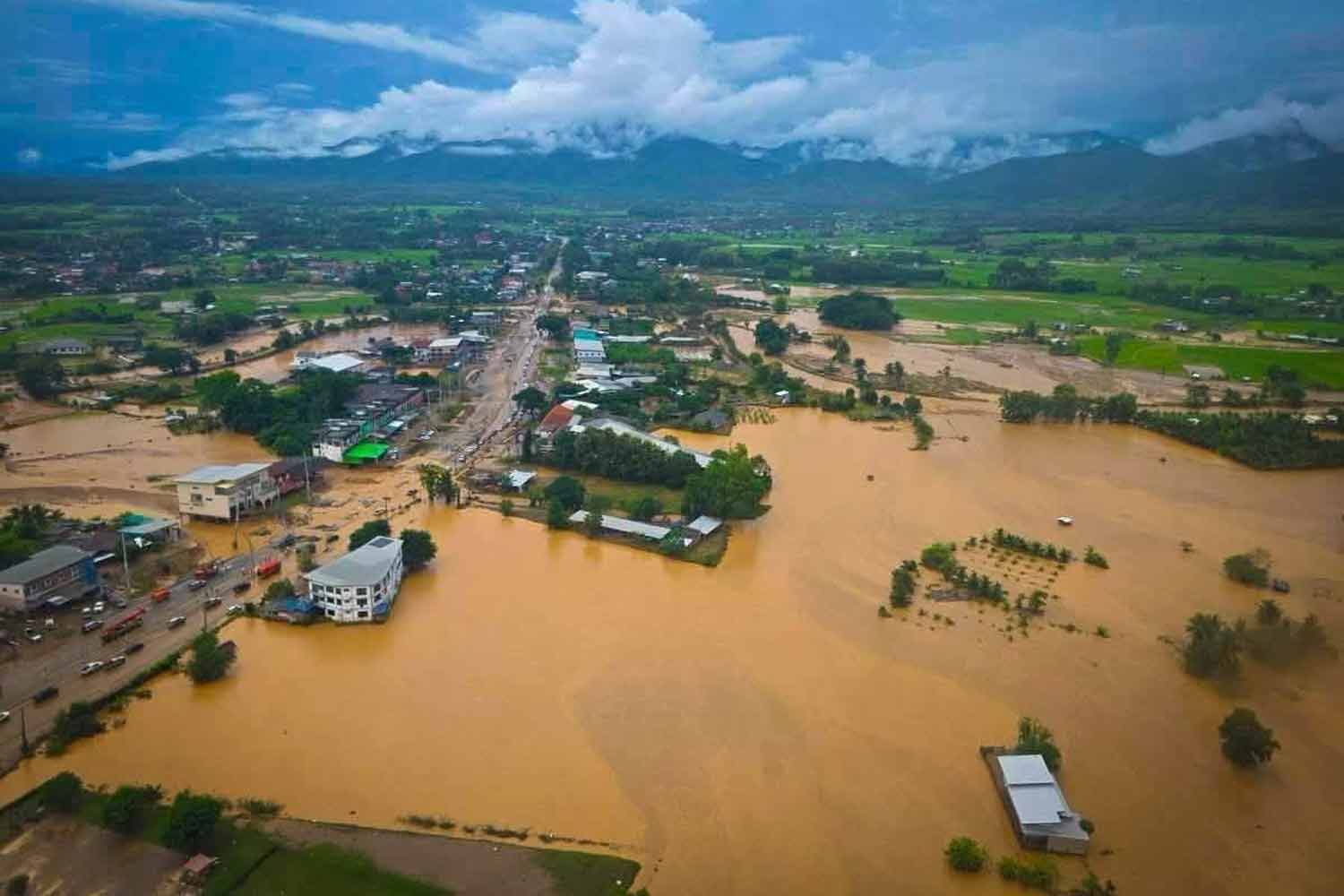 The overflowing Nan River near Muang and Phu Phiang districts on Thursday. Photos: Department of Disaster Prevention and Mitigation