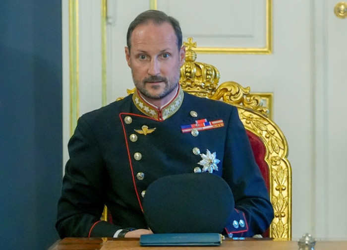 Norway, in mourning, enters new era under Haakon VIII