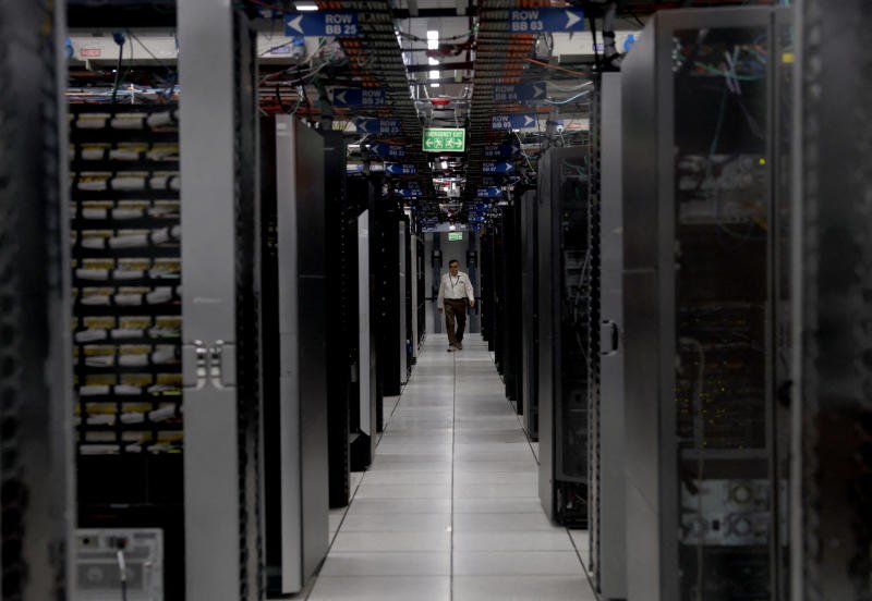 An employee walks through a data centre of Hewlett Packard Enterprise (HPE) inside its office building in Bengaluru, India, on May 29, 2026. (File photo: Reuters)