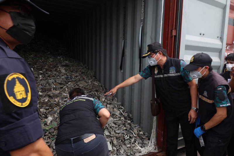 Officials check electronic waste in a container at Laem Chabang Port in Chon Buri on Monday. Supplied photo