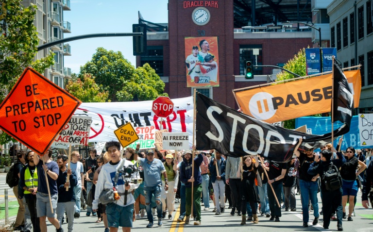 Demonstrators take part in a 'Stop the AI Race' protest march held in San Francisco in July. (Photo: AFP)