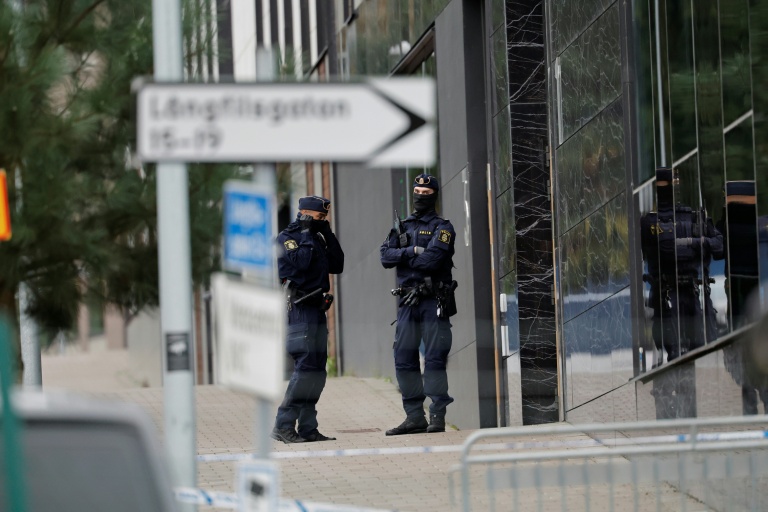 Swedish police stand guard outside the offices of an Israeli military technology company in Gothenburg where shots were fired in October 2024. (Photo: AFP)