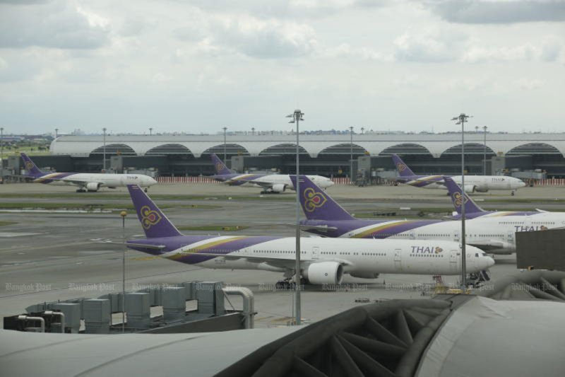 Thai Airways planes are seen on the tarmac at Suvarnabhumi airport in 2021. (Bangkok Post file photo)