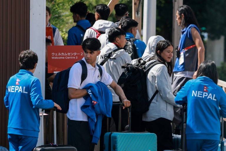 Members of Nepal's delegation arrive at the Asian Games in Nagoya.