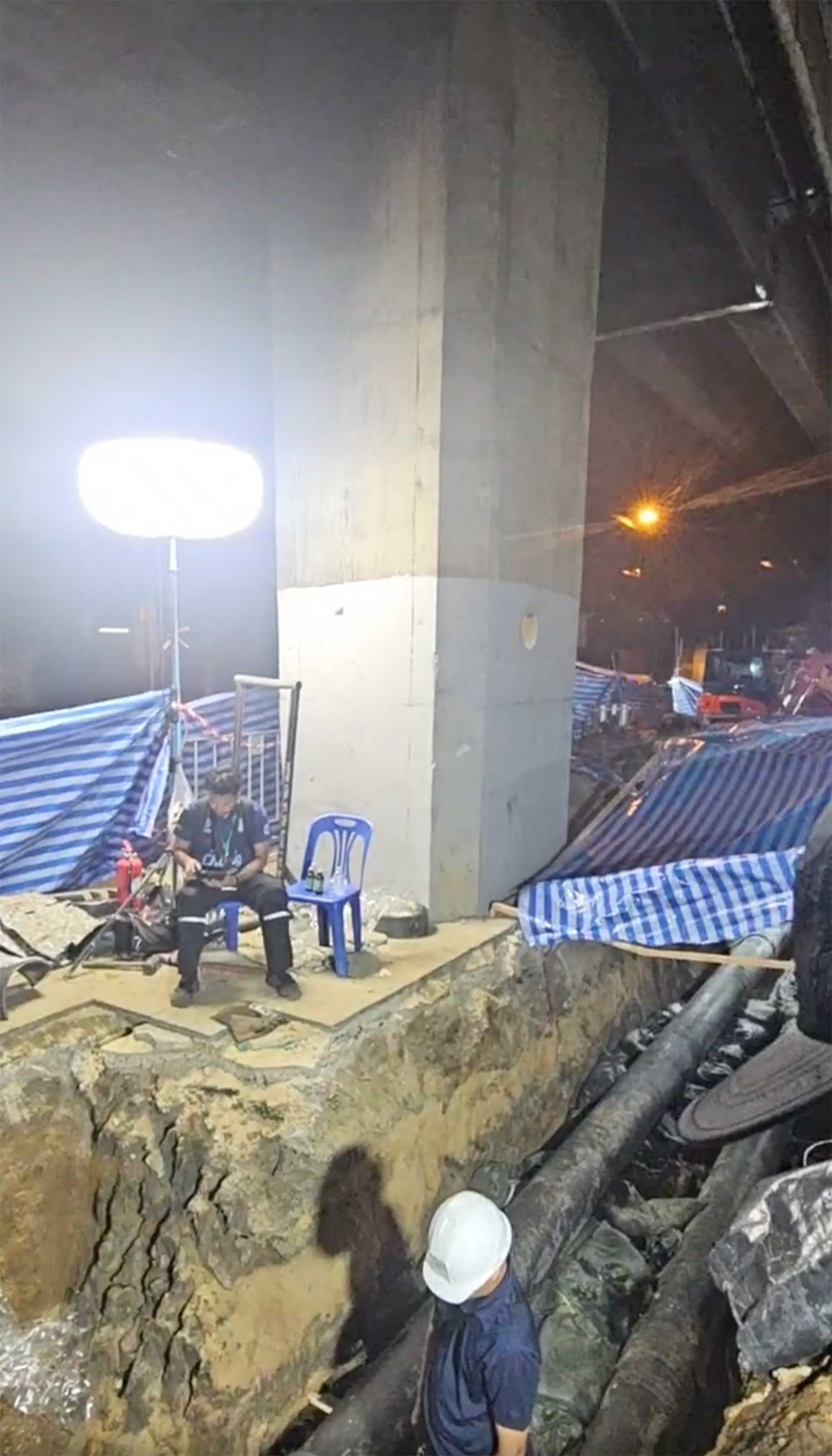 An expressway pillar stands on its foundation where the fuel pipe leaked.