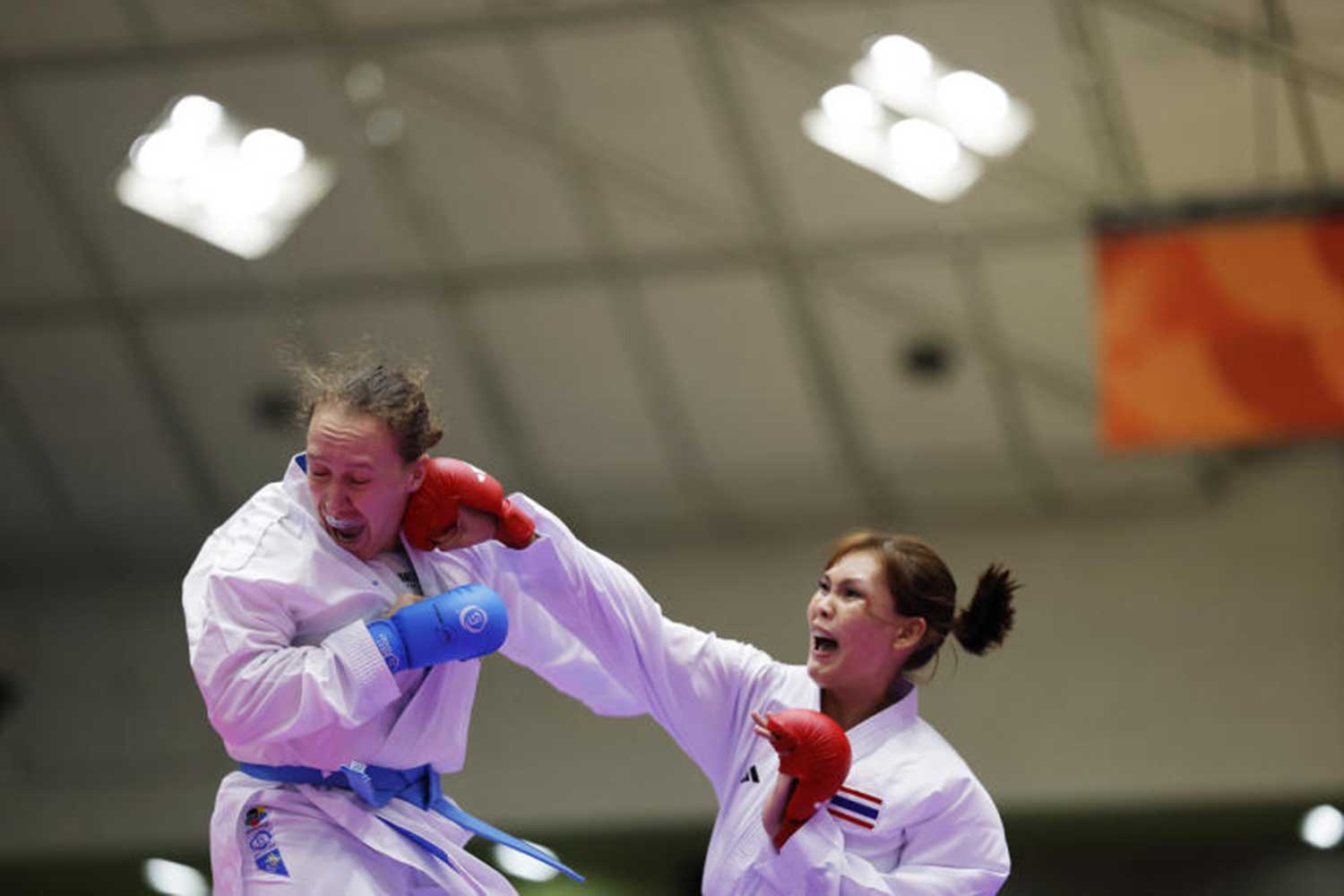 Asian Games - Aichi-Nagoya 2026 - Karate - Women's Kumite +68kg Final - Toyohashi City General Gymnasium, Toyohashi, Japan - September 20, 2026 Thailand's Maneevan Butsuwan in action during her final bout against Kazakhstan's Sofya Berultseva REUTERS