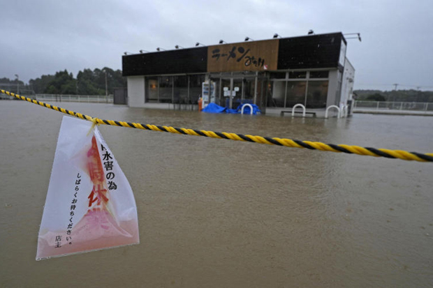 The area around a ramen restaurant is flooded by heavy rain as Typhoon Dujuan approaches, in Oamishirasato, Chiba prefecture, Japan, on Monday. (Photo: Kyodo via Reuters)