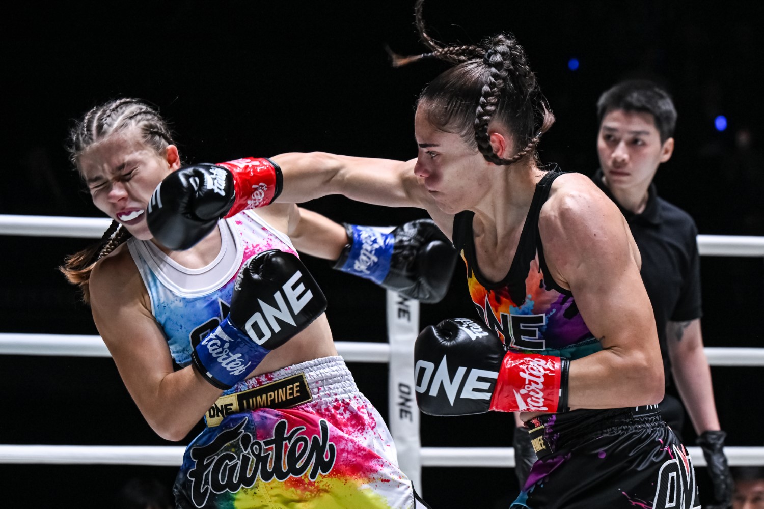 Antonia Prifti (right) lands a punch on Ameline Gerson during their strawweight kickboxing bout at Lumpinee Stadium