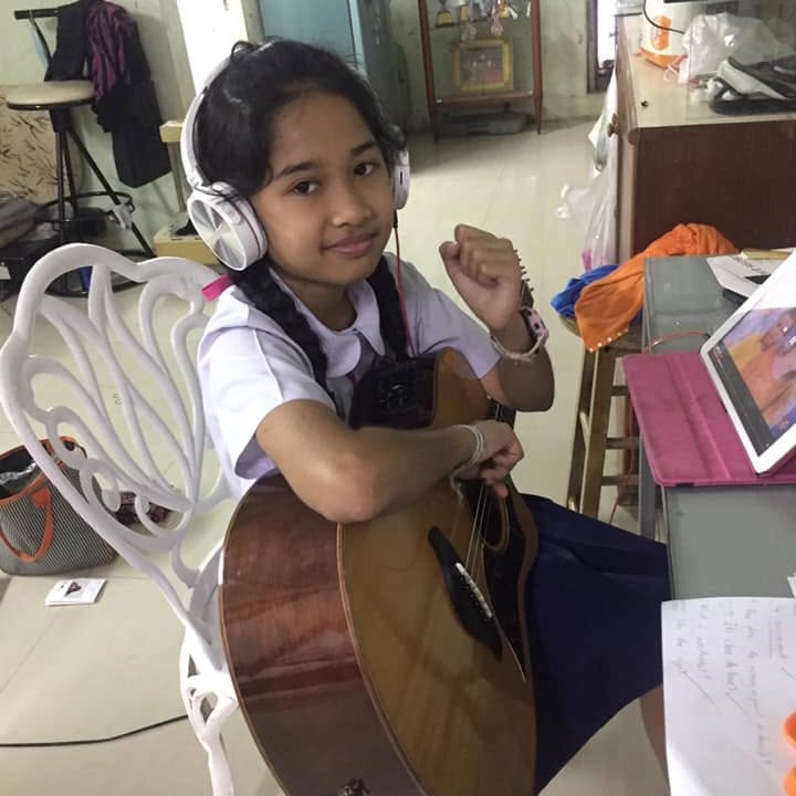 Nene Royal has been playing guitar since the age of seven, teaching herself from online videos. (Photo: Nene's father Narong Amploy Facebook account)