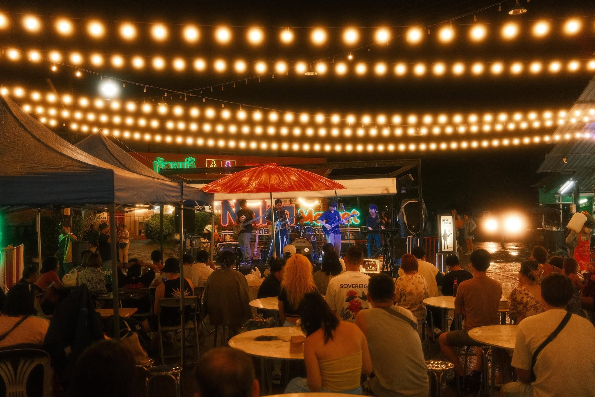 Nene Royal and her band, Ozone, perform for a crowd at Naka Weekend Market in Phuket in September 2024. (Photo: OZONE Band FC Facebook page)