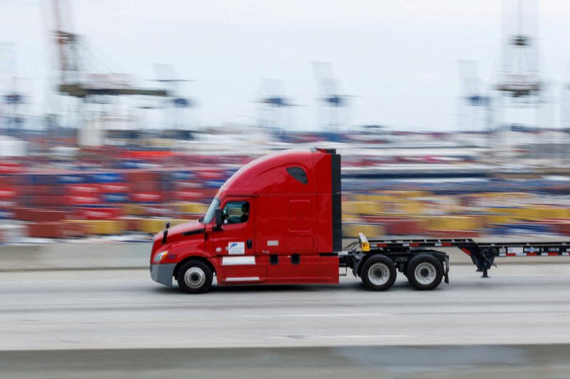 A semi-truck drives past Chinese shipping containers at the Port of Los Angeles in Wilmington, California, on Nov 5, 2025. The United States is Thailand's largest exporting market. (Photo: Reuters)