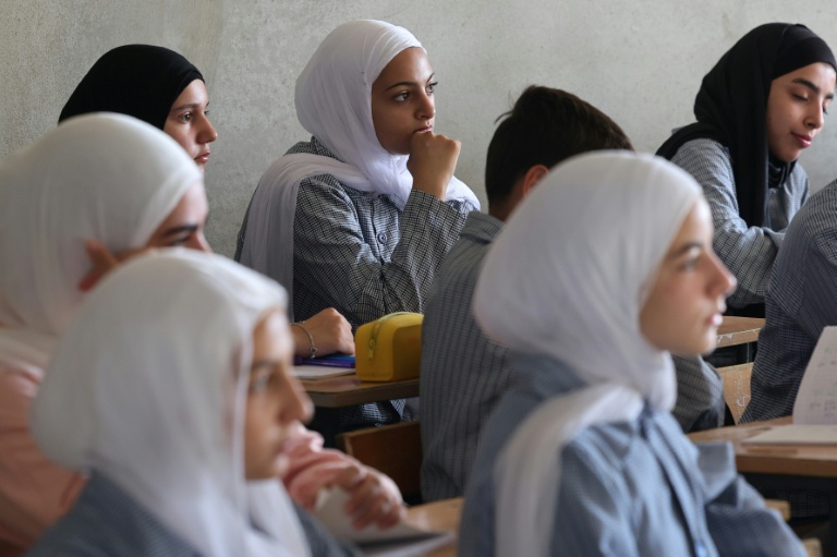 Students attend class at Yara Ajami's elementary school in Burj Qalaway, which was levelled by an Israeli strike in May. (Photo: AFP)
