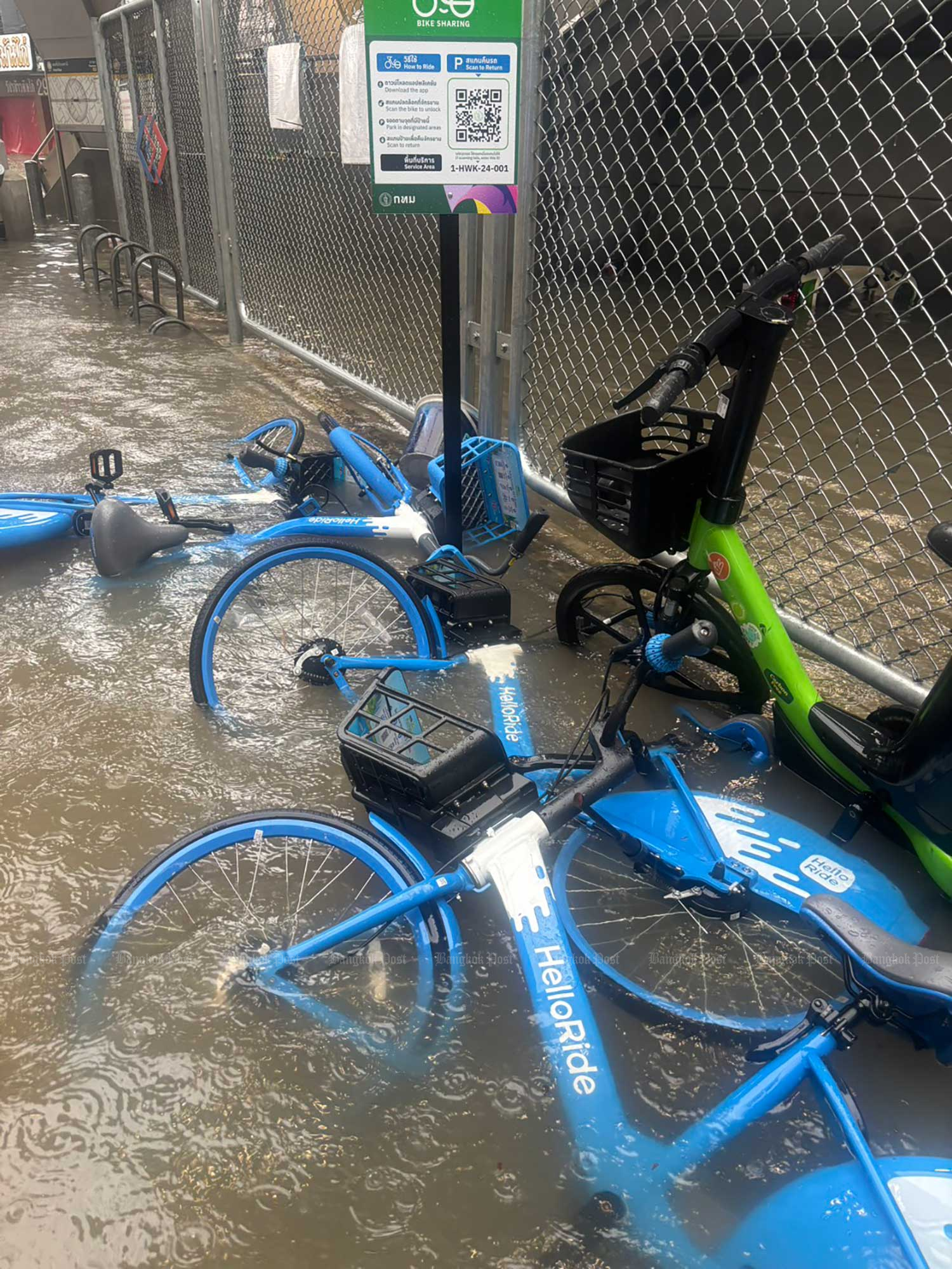 Bicycles fell in a flooded area on Lat Phrao 41 Road in Chatuchak district, Bangkok, on Sunday morning. Charoen Kittikanya