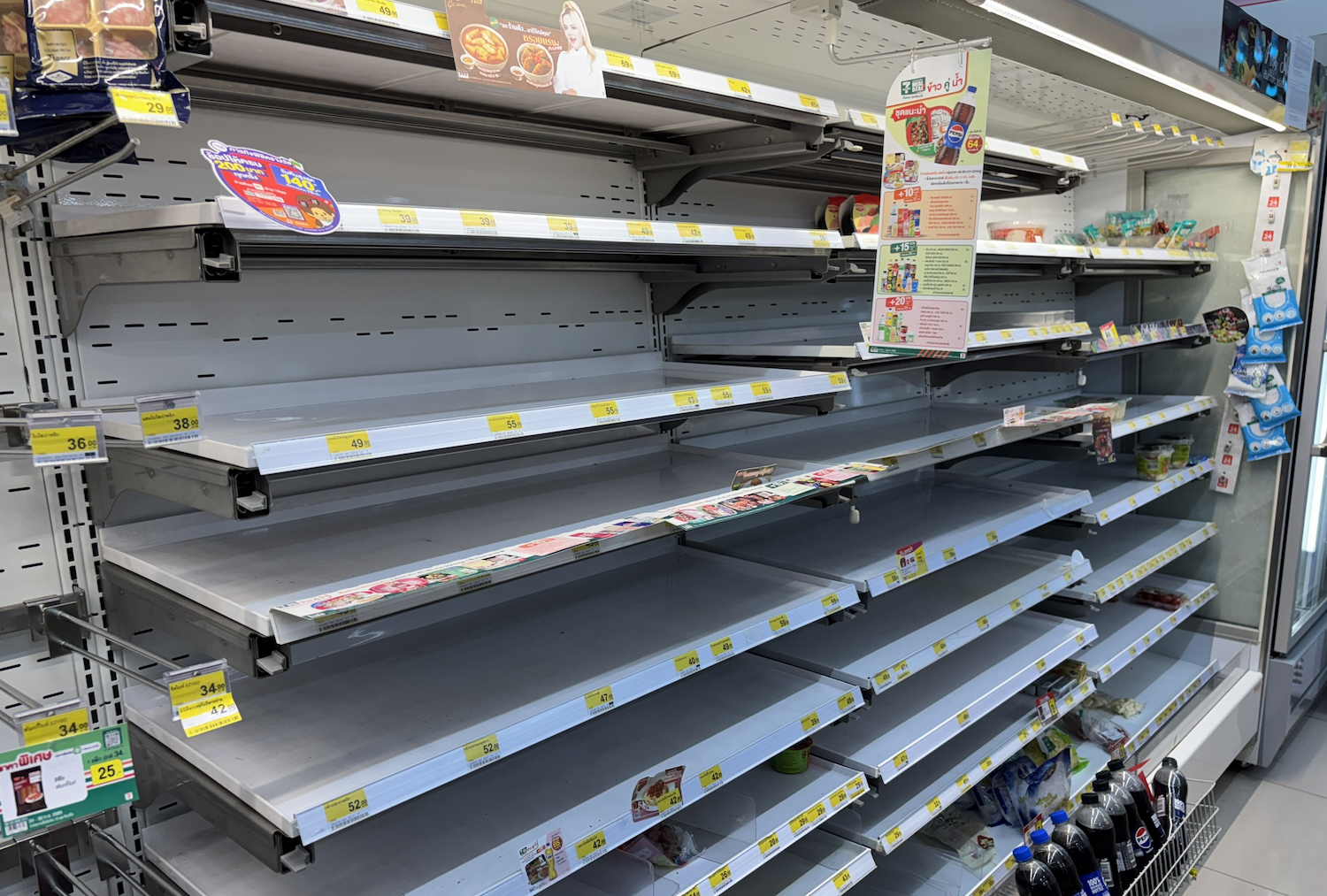 Shelves at a 7-Eleven store in the Pracha Chuen area of the capital on Saturday morning.