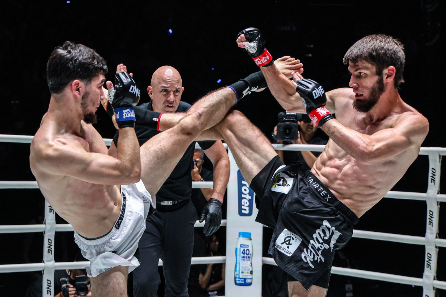 Asadula Imangazaliev (right) and Aslamjon Ortikov clash during their ONE flyweight Muay Thai title fight (Large)