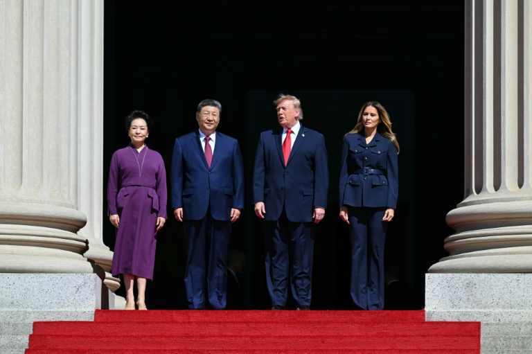 US President Donald Trump, First Lady Melania Trump, China's President Xi Jinping and his wife Peng Liyuan stand together as they arrive to visit the National Archives in Washington. (Photo: AFP)