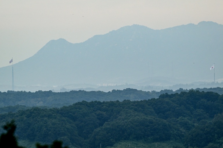 National flags of North Korea (left) and South Korea are seen within the Demilitarised Zone on Sept 12, 2026. (Photo: AFP)
