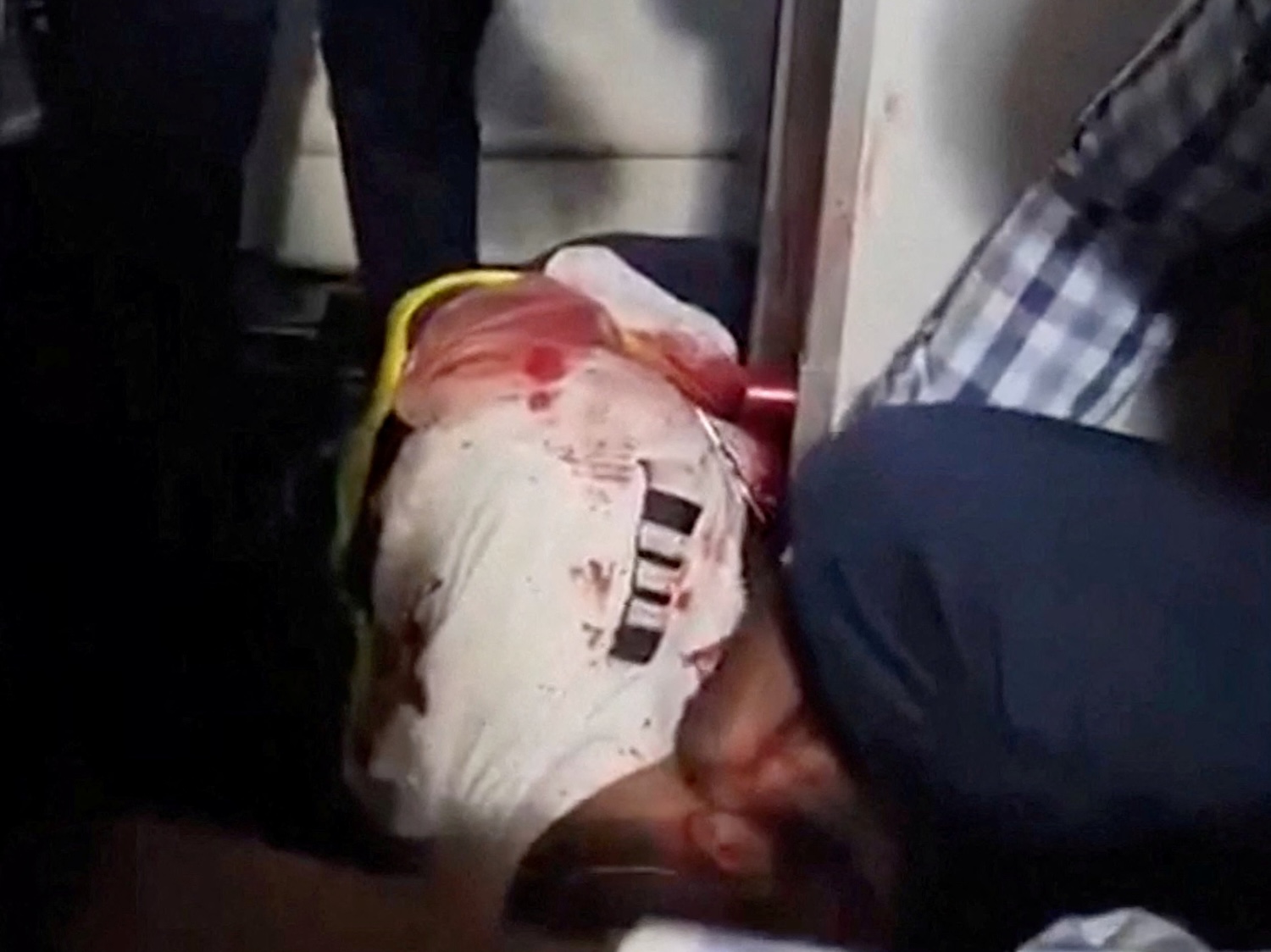 A verified image from a video posted on social media shows passengers gathered around an injured man aboard a Tel-Aviv-bound flydubai plane that was forced to land in Saudi Arabia after the pilots reportedly fought in the cockpit on Sept 30, 2026. (Photo via Reuters)