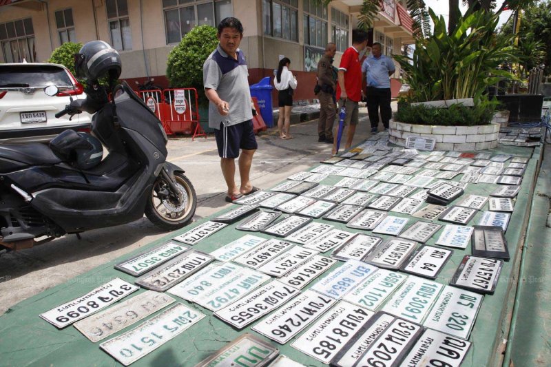 Dozens of vehicle licence plates detached from cars navigating floodwater await their owners at Pak Kret police station in Nonthaburi. Police have recovered more than 300 lost plates so far and expect to find many more. Pattarapong Chatpattarasill