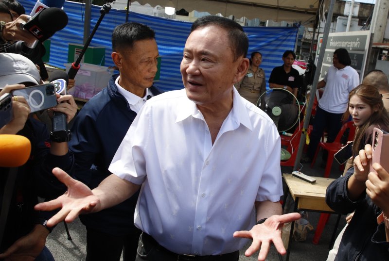 Former prime minister Thaksin Shinawatra speaks to reporters after casting his vote in the Bangkok gubernatorial election on June 28, 2026. (Photo: Pattarapong Chatpattarasill)