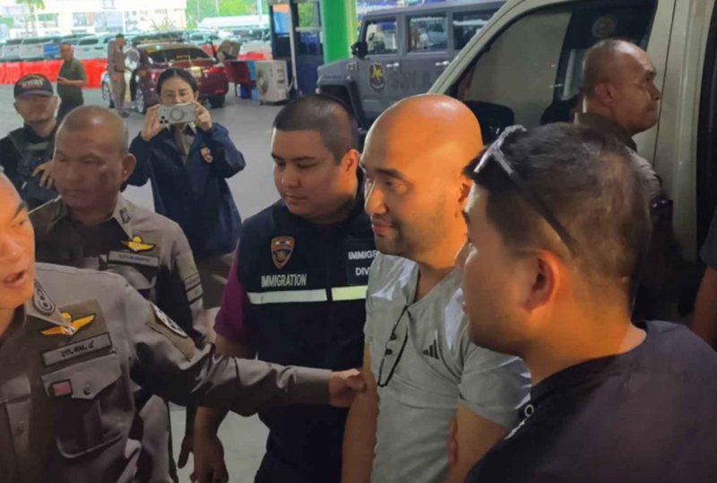 Win Thanaphatcharaphokin, one of three key suspects arrested in connection with the civil service exam-rigging case, is taken into police custody in Nong Khai in July 2026. (Police photo)