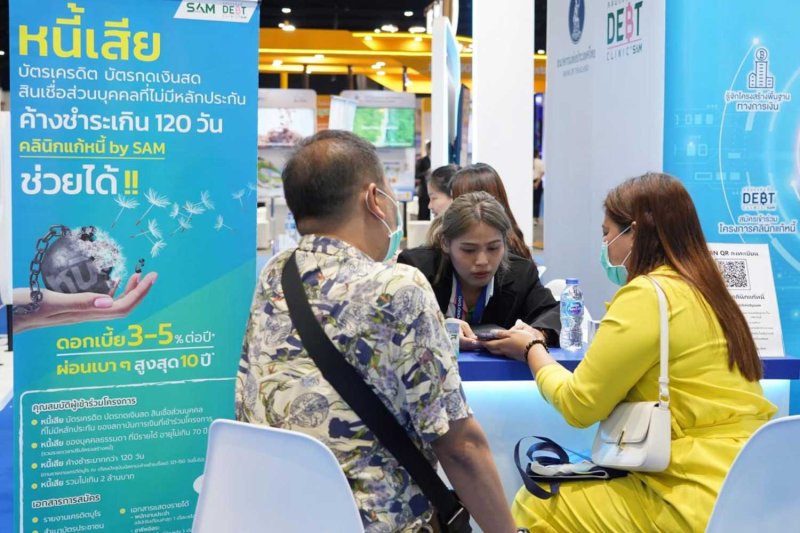 Consumers seek debt solutions at the central bank's Debt Clinic during a recent Money Expo in Bangkok. Thailand's banking sector NPL ratio stands at nearly 4% and is expected to remain elevated at 3-4% over the next two to three years.