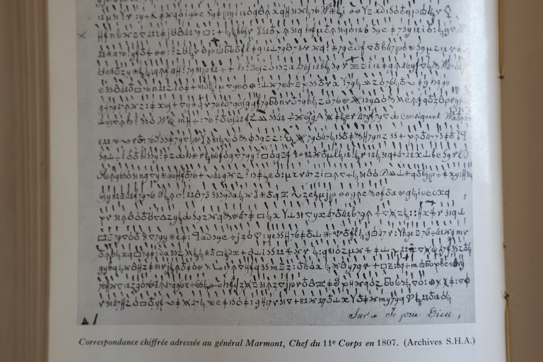 A reproduction of a wartime letter addressed to one of Napoleon's generals written in secret code in 1809, detailing the positions of French troops.