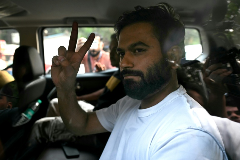 Cockroach Janata Party founder Abhijeet Dipke waves from a car after being released from detention a day after his arrest during a police crackdown on protests against India’s election authority. (Photo: AFP)