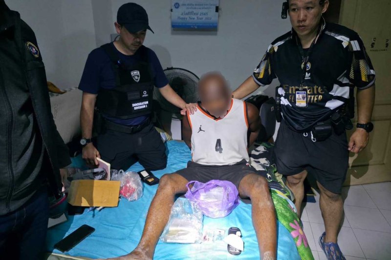 Police arrest one of the suspects on Friday. Police photo